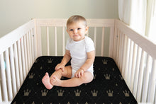 Load image into Gallery viewer, Designer Jersey Fitted Crib Sheet - Gold Crowns on Black