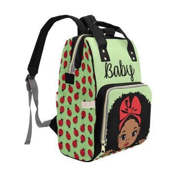 Super Cute African American Baby Girl With Natural Curls and Red Bow On Green Ladybug Diaper Bag